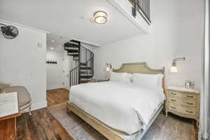Bedroom with wood finished floors and recessed lighting
