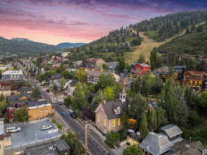 Aerial view at dusk of a mountain view and a residential view