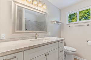Full bathroom featuring vanity and a shower