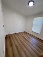 Unfurnished room featuring wood finished floors