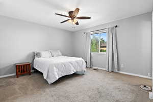 Bedroom with carpet flooring and ceiling fan