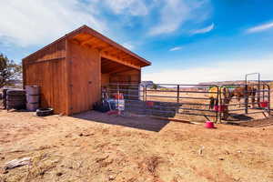 View of outbuilding with an exterior structure