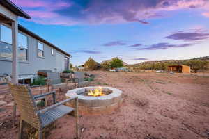 View of yard with an outdoor fire pit