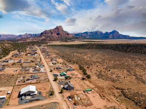 View of rural area featuring a mountain backdrop and a desert landscape