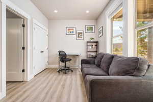 Office featuring light wood-style floors and recessed lighting