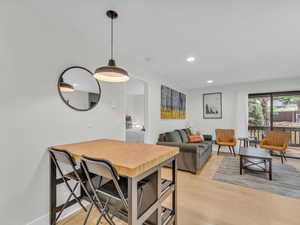 Dining space featuring light wood-style floors and recessed lighting