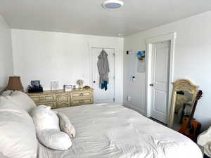 Bedroom featuring a textured ceiling