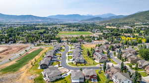 Aerial view of residential area featuring a mountainous background