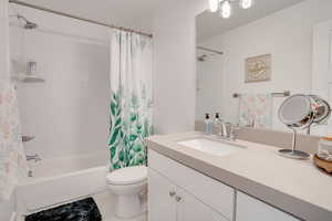 Full bath with vanity and shower / bath combo