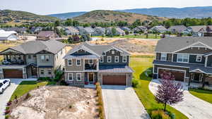 Aerial view of residential area featuring a mountain backdrop