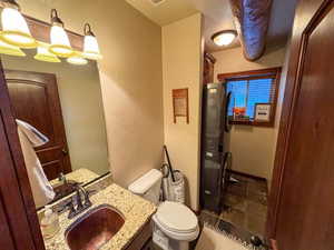 Bathroom featuring vanity and toilet