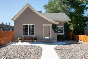 View of front facade featuring stucco siding