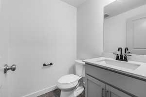Bathroom with vanity and wood finished floors