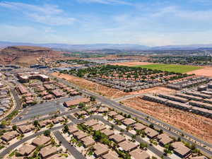Aerial perspective of suburban area featuring a mountainous background