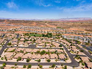 Aerial perspective of suburban area featuring a mountain backdrop