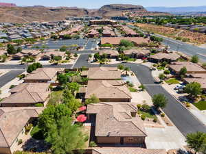 Aerial view of residential area featuring a mountainous background
