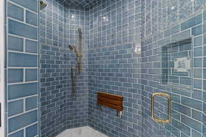 Bathroom featuring a shower stall