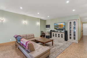 Living room featuring recessed lighting and baseboards