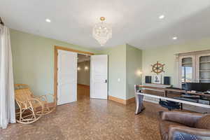 Home office featuring a chandelier and recessed lighting