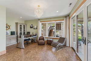 Office space with a chandelier and recessed lighting