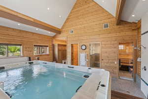 View of pool featuring a hot tub