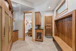 Mudroom featuring baseboards and recessed lighting