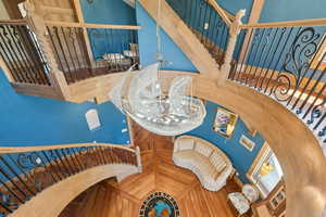 Stairway featuring a chandelier