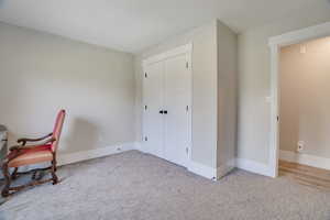 Unfurnished room with carpet flooring and baseboards