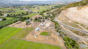 Aerial view of property's location featuring rural landscape and mountains