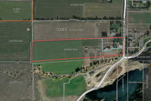 Aerial map of property and surrounding area featuring property boundaries highlighted