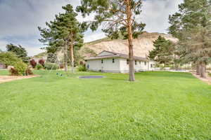 View of green lawn with a mountain view