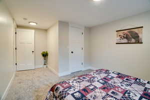 Carpeted bedroom with baseboards