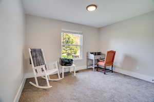 Office area featuring carpet and baseboards