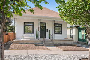 View of front of property with a Craftsman Bungalow and shaker shingle siding featuring covered porch and a shingled roof