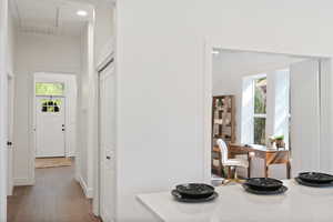 Hallway featuring wood finished floors and recessed lighting