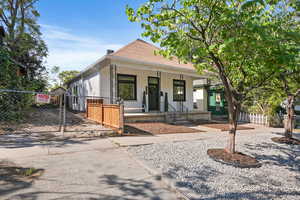 View of front of home with a gate and covered porch