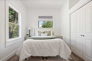 Bedroom with a closet and carpet floors