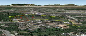 Aerial overview of property's location featuring property boundaries highlighted and mountains