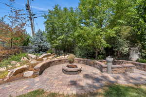 View of patio featuring a fire pit