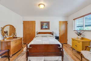 Bedroom with light wood-style flooring