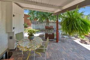 View of patio / terrace featuring outdoor dining area and grilling area