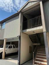 View of property exterior featuring stairs