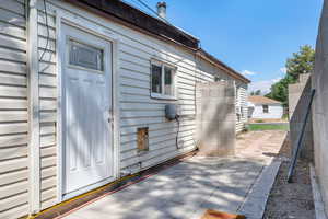 Doorway to property featuring a patio