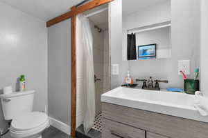 Bathroom featuring vanity and a stall shower