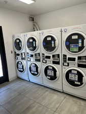 Shared laundry with stacked washer / dryer and washing machine and clothes dryer