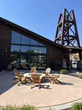 View of patio with an outdoor fire pit