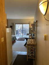 Corridor featuring carpet