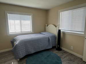 Bedroom with wood finished floors