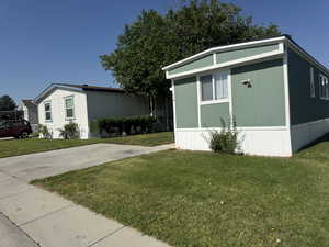 View of home's exterior featuring a yard