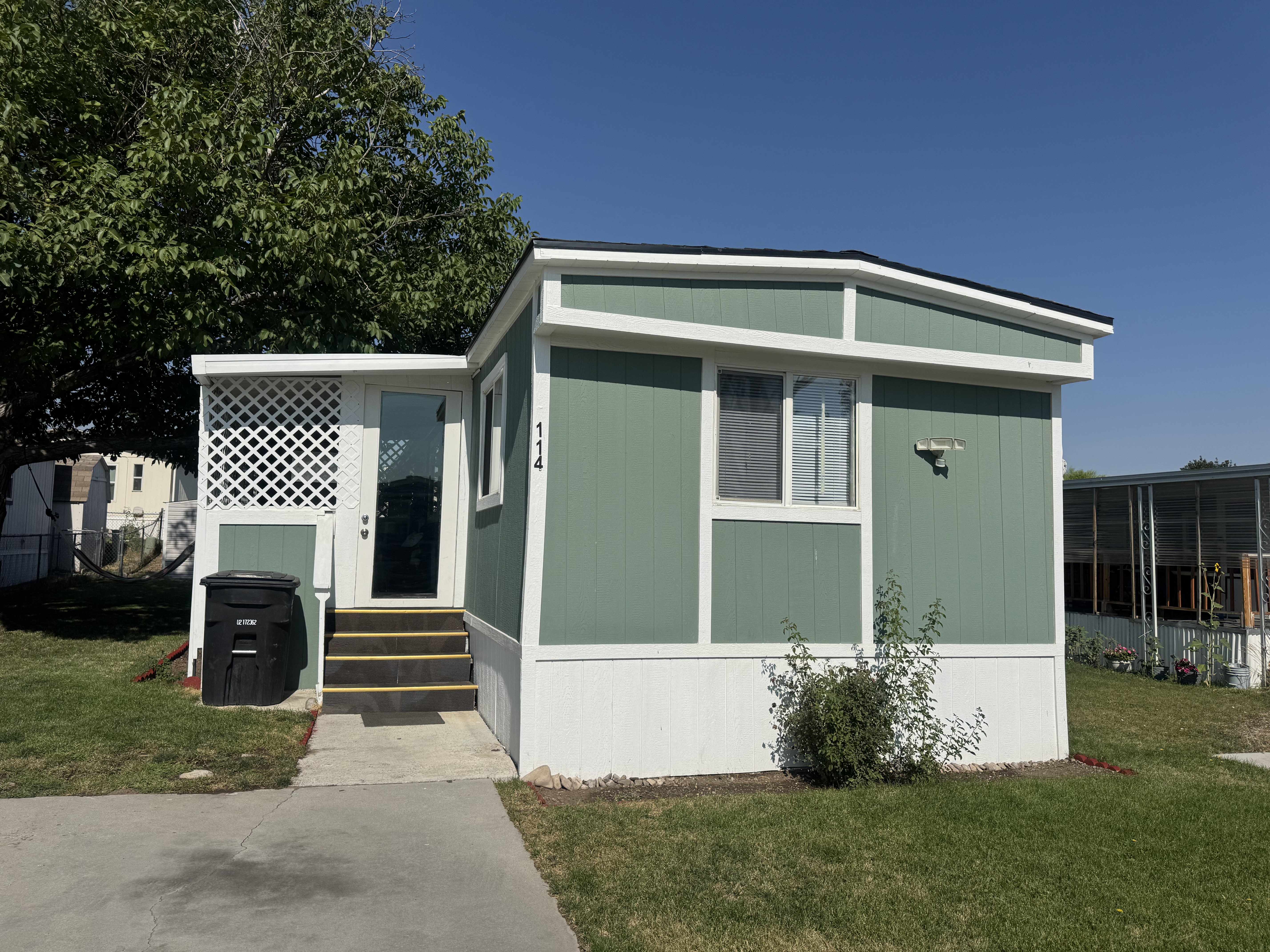 View of front of property featuring a front yard and entry steps